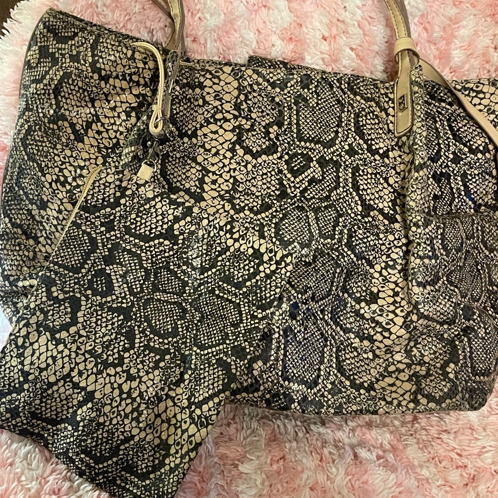 Snakeskins dialed tote with a pouch to match. New without tags.
